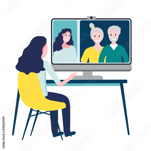 Woman having online meeting with parents or eldery family members via group call on big screen of computer. Video conference at home concept. Video call communication.