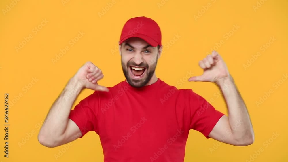 Delivery confident happy young guy man in red cap blank t-shirt uniform workwear isolated on yellow background studio Professional male deliveryman employee courier Service concept pointing on himself Delivery confident happy young guy man in red cap blank t-shirt uniform workwear isolated on yellow background studio Professional male deliveryman employee courier Service concept pointing on himself