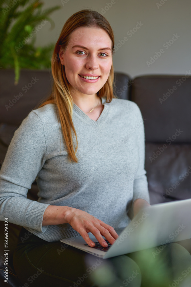 young beautiful woman using a laptop computer at home young beautiful woman using a laptop computer at home