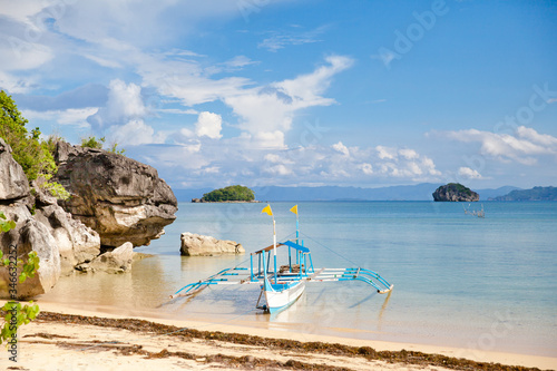 Beautiful seascape with a boat. Rocks by the sea on Caramoan Island, Philippines, Asia. Beautiful seascape. Summer and travel vacation concept.