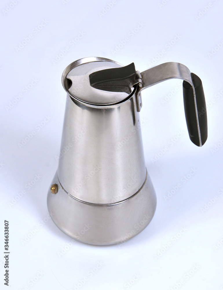 Coffee pot for brewing coffee on an open fire, isolated on a white background. Close-up Coffee pot for brewing coffee on an open fire, isolated on a white background. Close-up