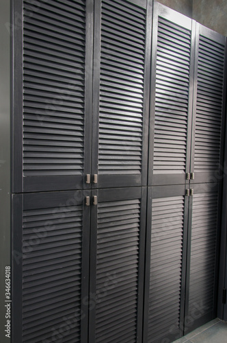 Iron shutters of a metal cabinet close-up
