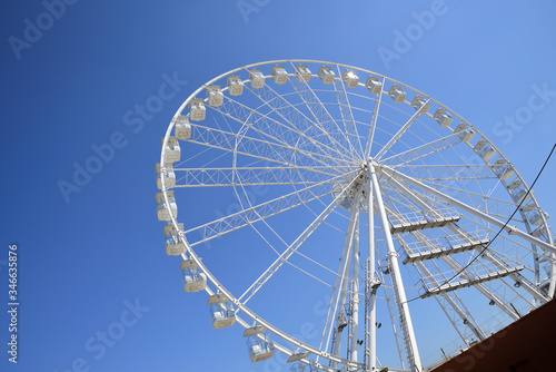 white Ferris wheel on the blue sky