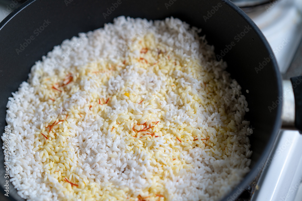 Rice is cooked on the stove