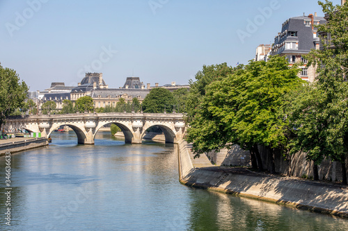 Paris, France - May 6, 2020: View of the Pont Neuf, bridge over the Seine in Paris and buildings along the river