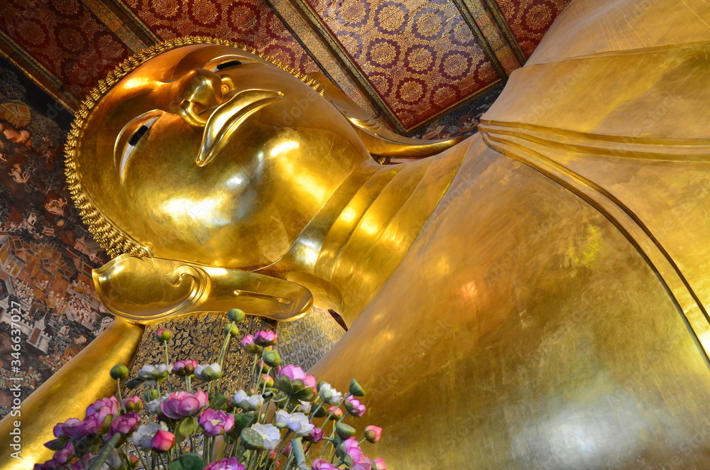 Beautiful face of the huge reclining buddha at Wat Pho in Bangkok