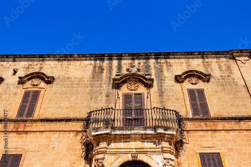 Old architecture in Fasano, Province of Brindisi, Apulia, Italy, architectural high section street detail of a beautiful old building