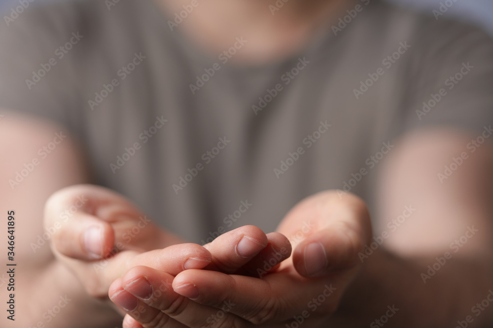 A man without head holding something without theme. A man without head holding something without theme.