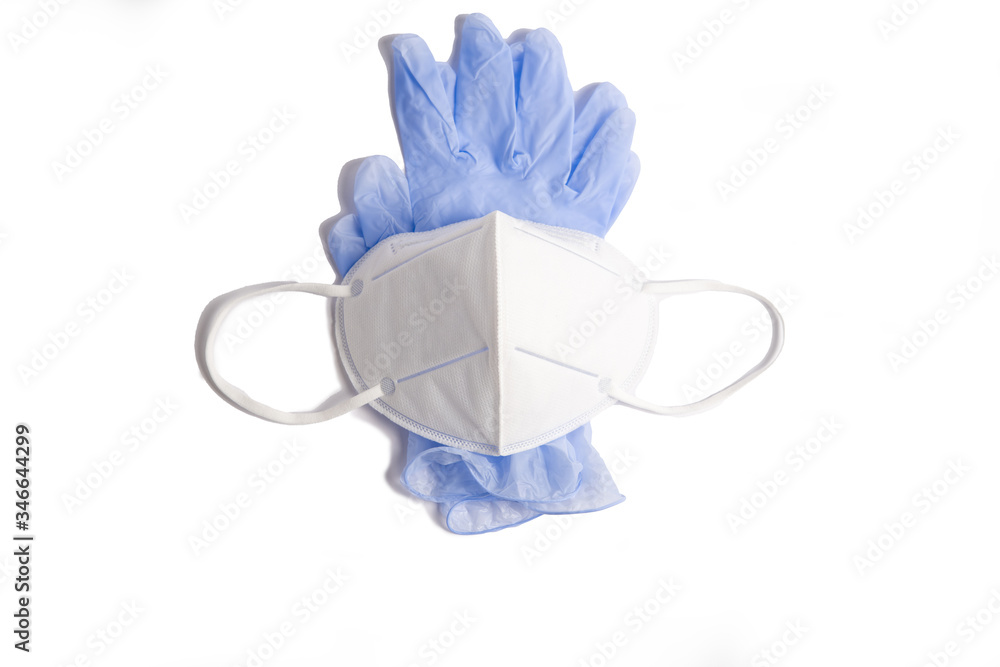 on a white background - medical gloves of blue color, and on top - a protective mask of white color, horizontal position on a white background - medical gloves of blue color, and on top - a protective mask of white color, horizontal position