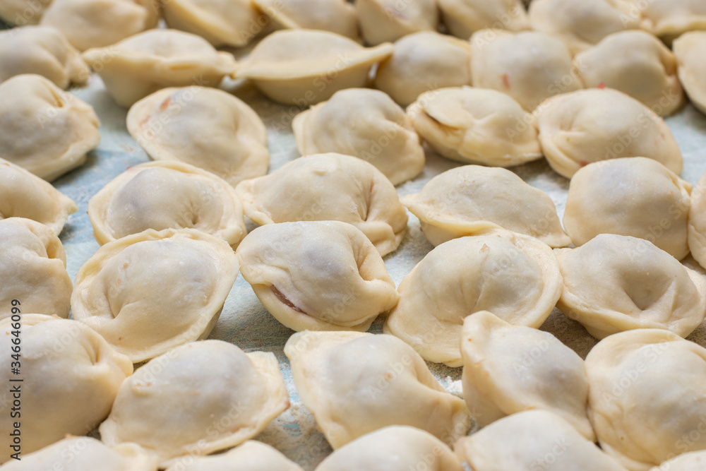 Blinded homemade dumplings lie on the table Blinded homemade dumplings lie on the table