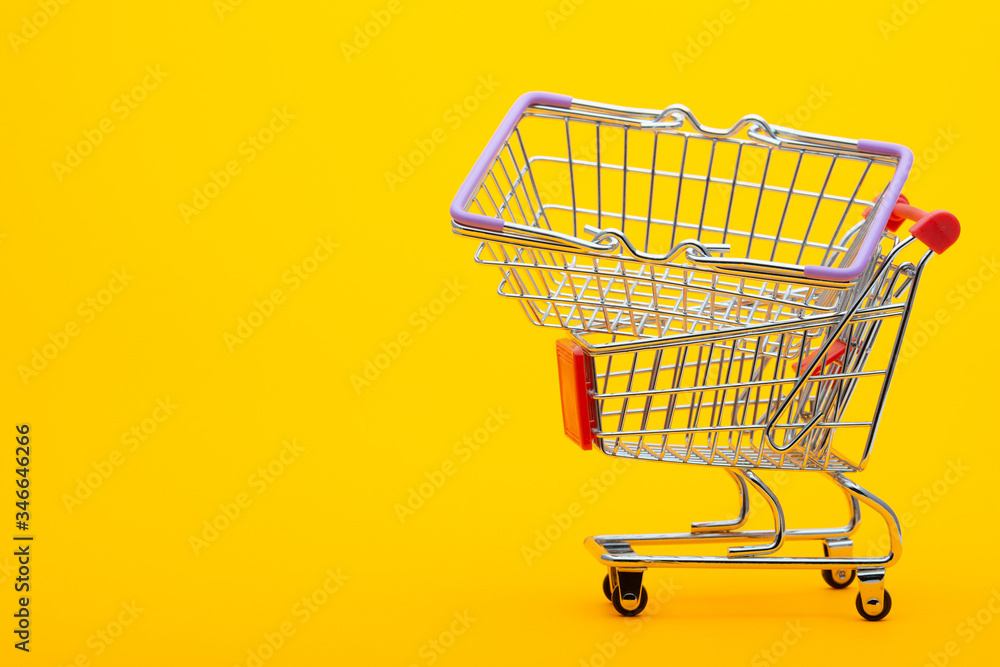 In an empty grocery cart lies an empty grocery basket In an empty grocery cart lies an empty grocery basket