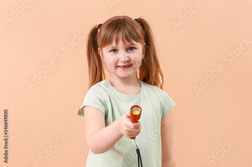 Little girl with flashlight...