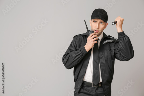 Male security guard with fl...