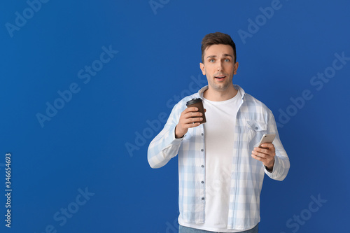 Handsome man with coffee an...