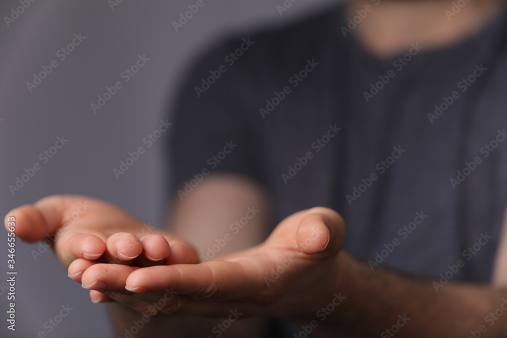 A man without head holding something without theme. A man without head holding something without theme.