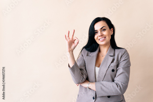 Close up photo beautiful amazing attractive lady arm show okey symbol, on the yellow bright background
