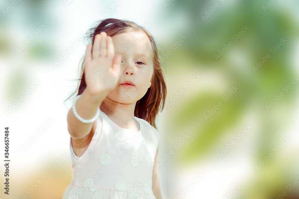 girl showing hand signaling to stop violence and pain
