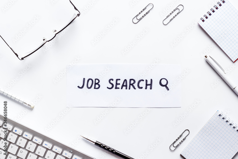 Job search. Flat lay, white office desk top-down Job search. Flat lay, white office desk top-down