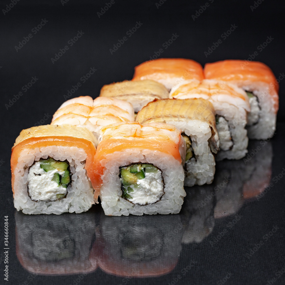 diverse delicious sushi roll set on a black background with reflection, menu diverse delicious sushi roll set on a black background with reflection, menu