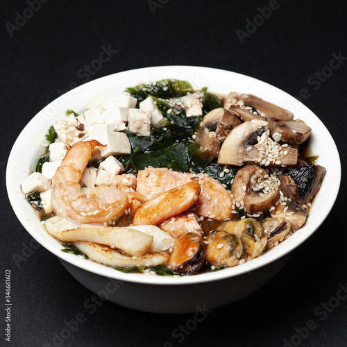 miso soup with meat on a black background, menu