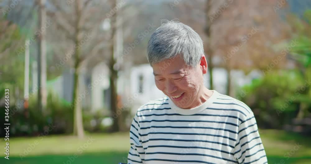 Asian elder use mobile phone Asian elder use mobile phone