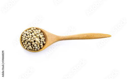 pepper corn in scoop  on white background