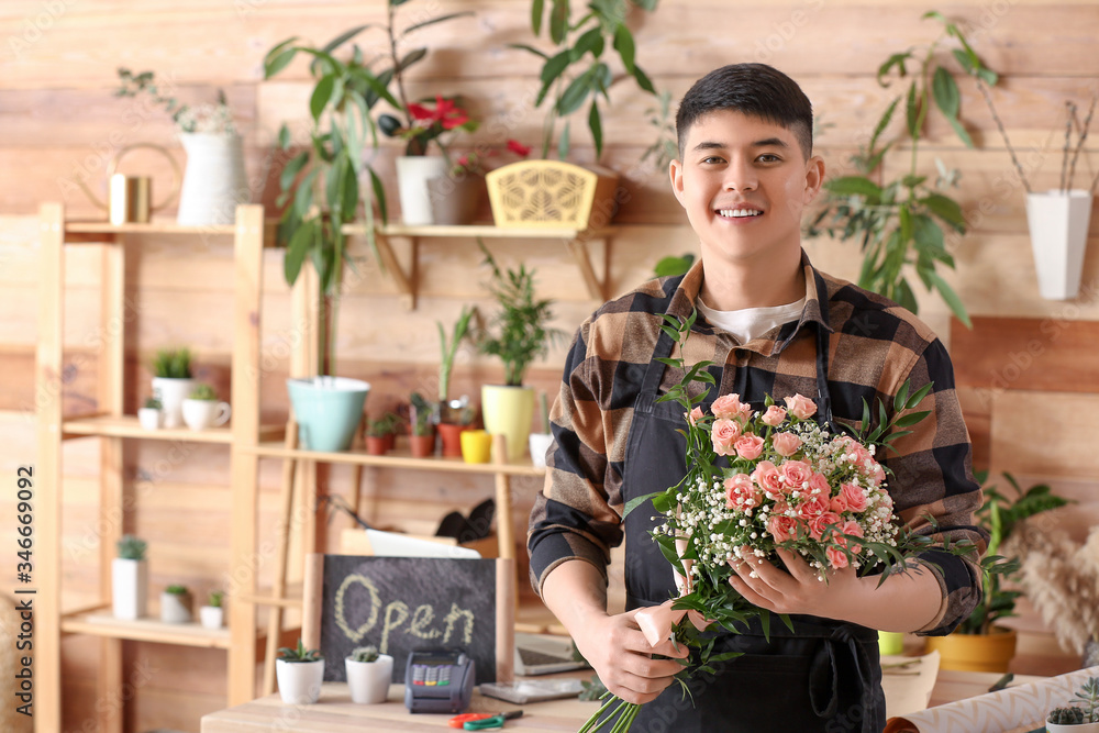 Portrait of Asian male florist in shop