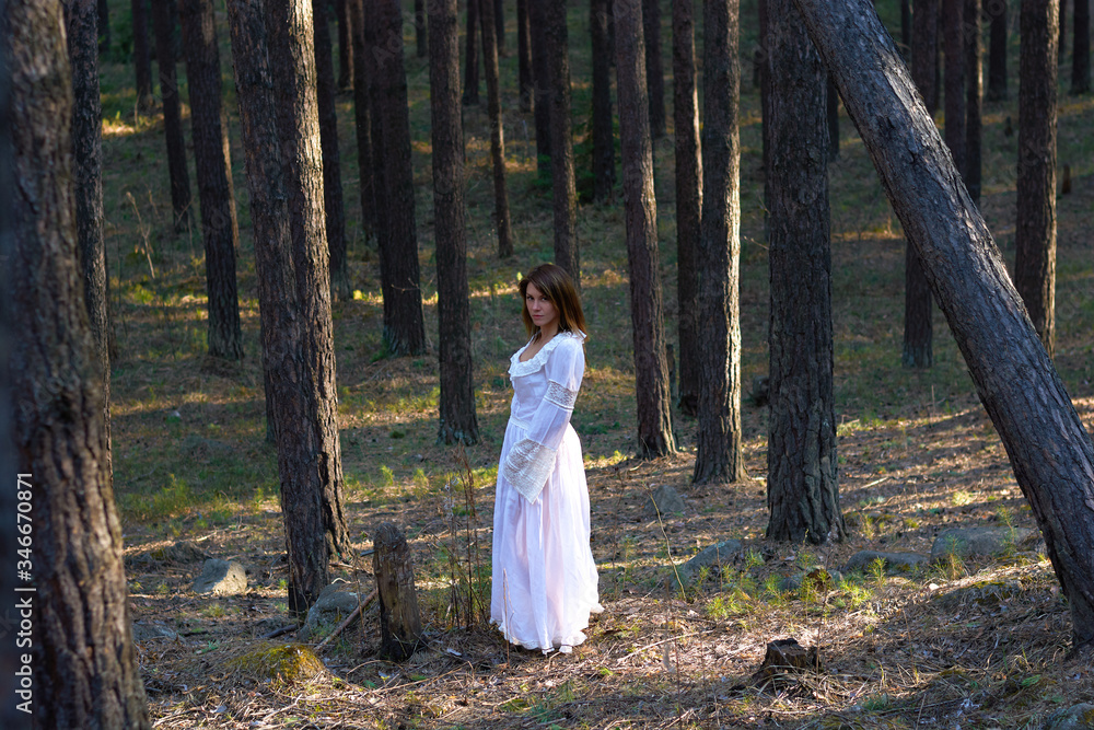 Girl in white dress in the woods Girl in white dress in the woods