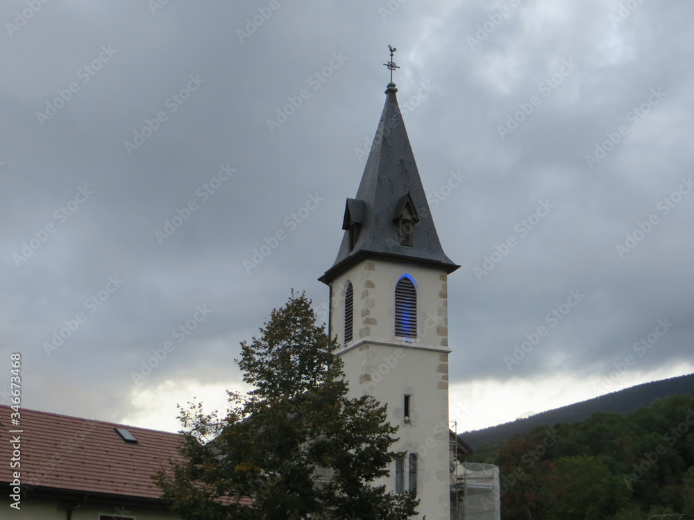 The Church of Our Lady of the Assumption in Balmont, Annecy, France. In the center of the hamlet of Balmont, the Notre-Dame de l'Assomption church rises its bell tower in the rural landscape.