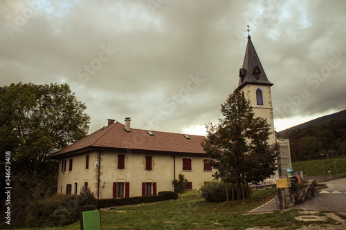 The Church of Our Lady of the Assumption in Balmont, Annecy, France. In the center of the hamlet of Balmont, the Notre-Dame de l'Assomption church rises its bell tower in the rural landscape.