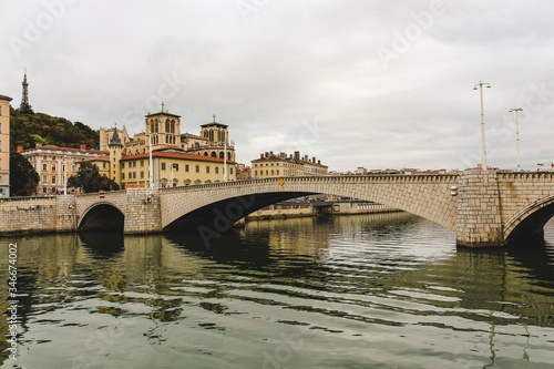 The Pont Bonaparte over the Saone river, the Basilica of Notre-Dame de Fourvièrel, Quai Fulchiron (quay), the Lyon Cathedral and the 5th Library St John Episcopal, France.