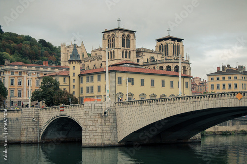 The Pont Bonaparte over the Saone river, the Basilica of Notre-Dame de Fourvièrel, Quai Fulchiron (quay), the Lyon Cathedral and the 5th Library St John Episcopal, France. photo