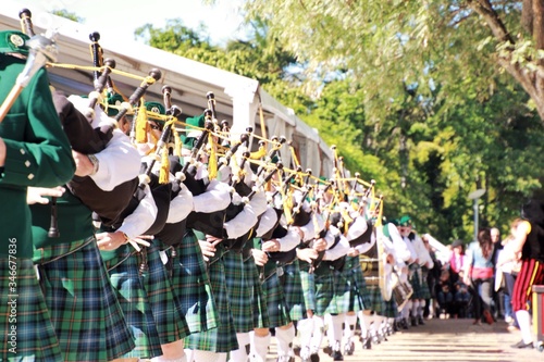 Photo Musicians Playing Bagpipes During Event