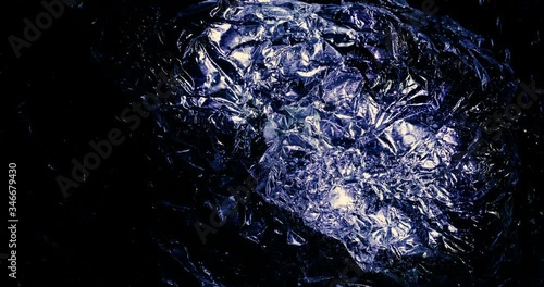 Holographic foil motion. Real metallic foil moving and reflecting vibrant colors.	