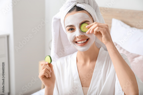 Morning of beautiful young woman taking care of her skin at home