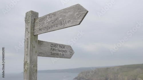 Footpath sign indicating the route of the famous South West Coast Path, slomo
 photo