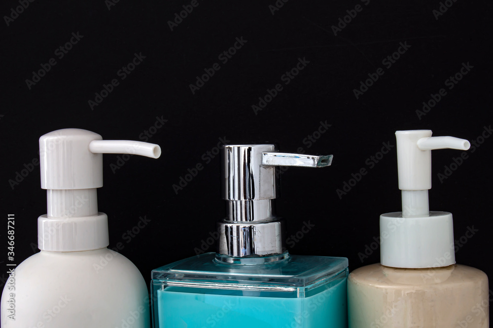 Close up top view of colorful soap dispenser for bathrooms or kitchen sinks on a black background Close up top view of colorful soap dispenser for bathrooms or kitchen sinks on a black background