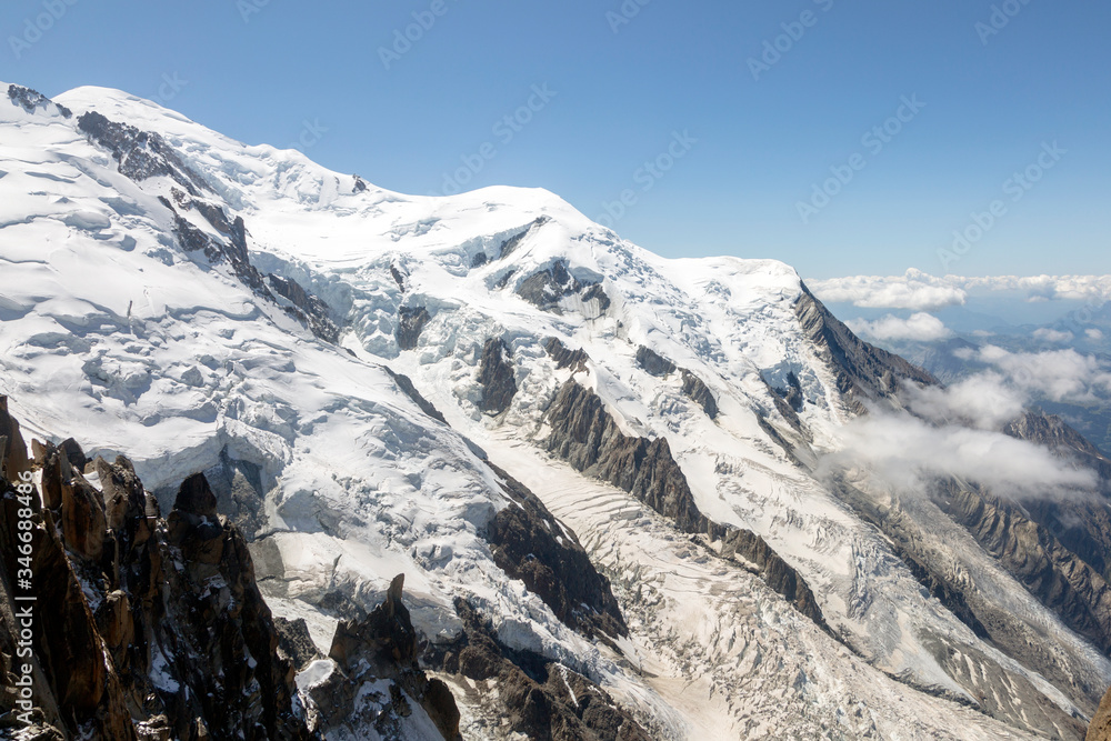Mont Blanc three mounts route (par les 3 monts) over Mont-blanc du Tacul, Mont Maudit and the main Alps mount Mont-Blanc. View from Aiguille du Midi Chamonix France