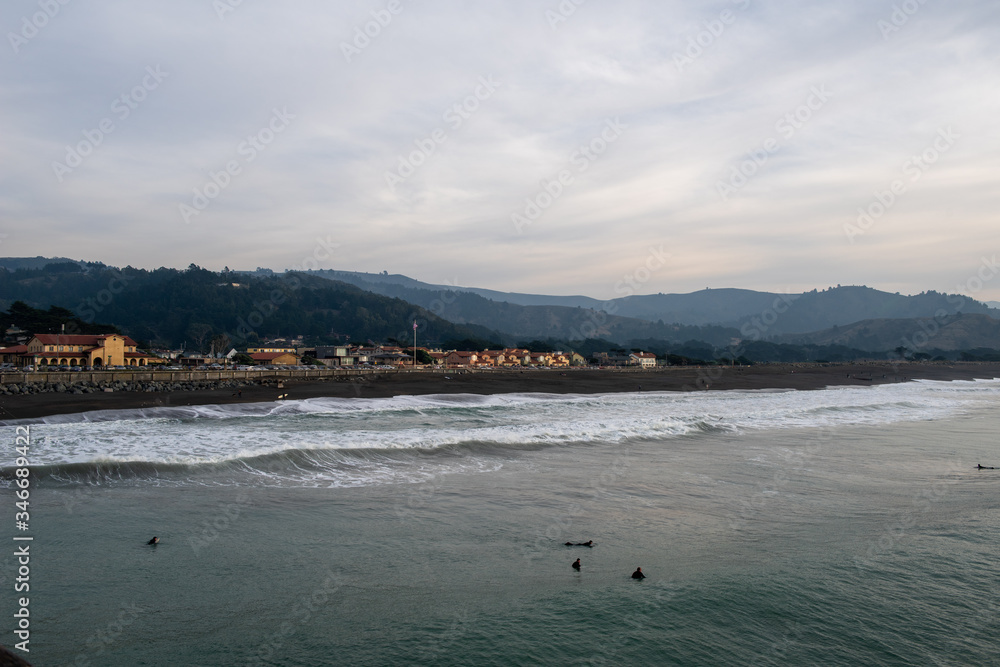 Beautiful evening in Pacifica, San Mateo county, California.  Surfers are catching waves