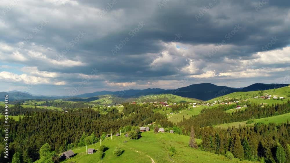 Aerial view of the village Yablunytsia in Carpatian mountains, landscape with a bird's eye view, drone camera. Aerial view of the village Yablunytsia in Carpatian mountains, landscape with a bird's eye view, drone camera.