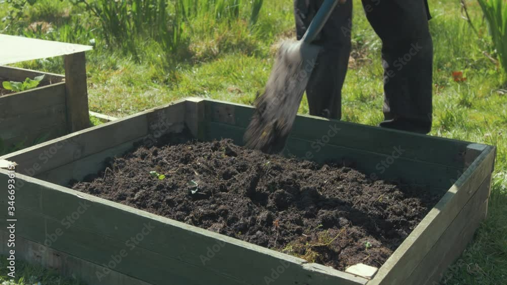 breaking up soil with shovel raised garden bed breaking up soil with shovel raised garden bed