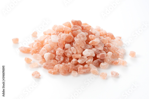 Pink rock salt placed on a white background