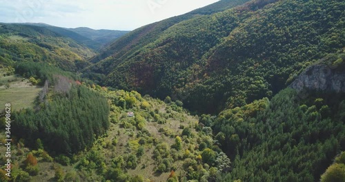 Flight in the autumn over a rocky valley in the mountain. photo