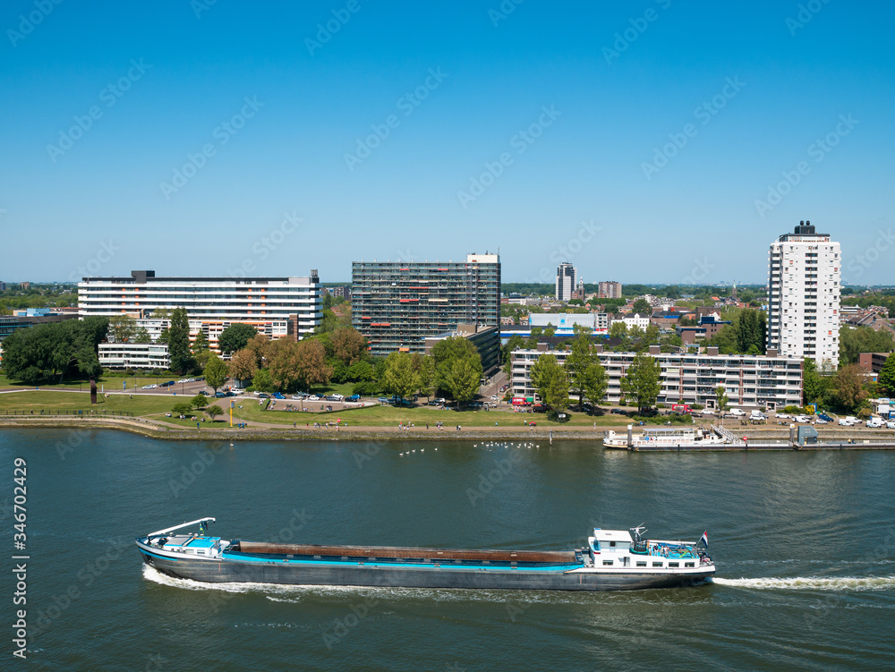 Obraz premium Rotterdam, Netherlands - May 07, 2020: view on the cargo port buildings infrastructure from cruise ship