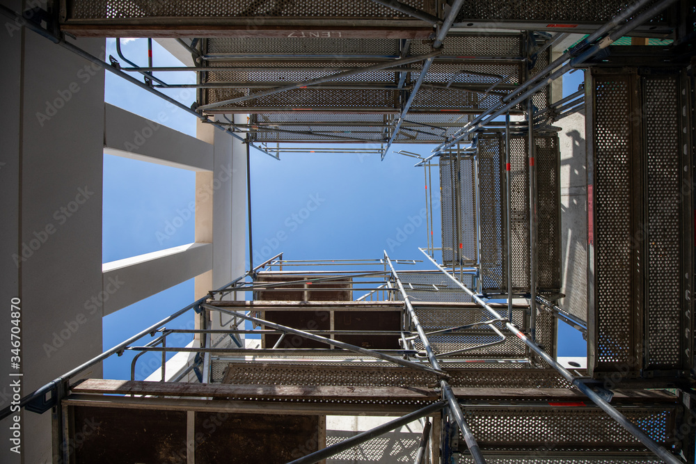 a building shaft is scaffolded on a construction site