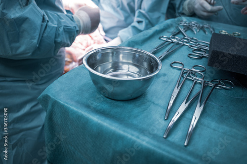 some sterile surgical instruments are on a table during an operation