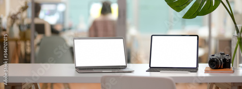 Wallpaper Mural Cropped shot of comfortable office desk with mock-up laptop, tablet, camera, office supplies and decoration Torontodigital.ca