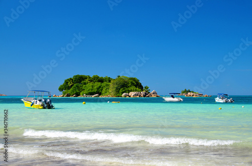 Tropical beach Anse Volbert with turquoise sea in island Praslin, Seychelles. photo