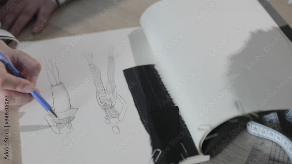 Slow motion video of the girl draws the sketch of future model of ...