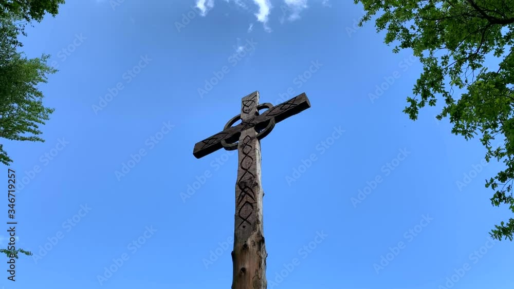 Wooden Cross On Mountain Peak after exhausting hike in summer Wooden Cross On Mountain Peak after exhausting hike in summer
